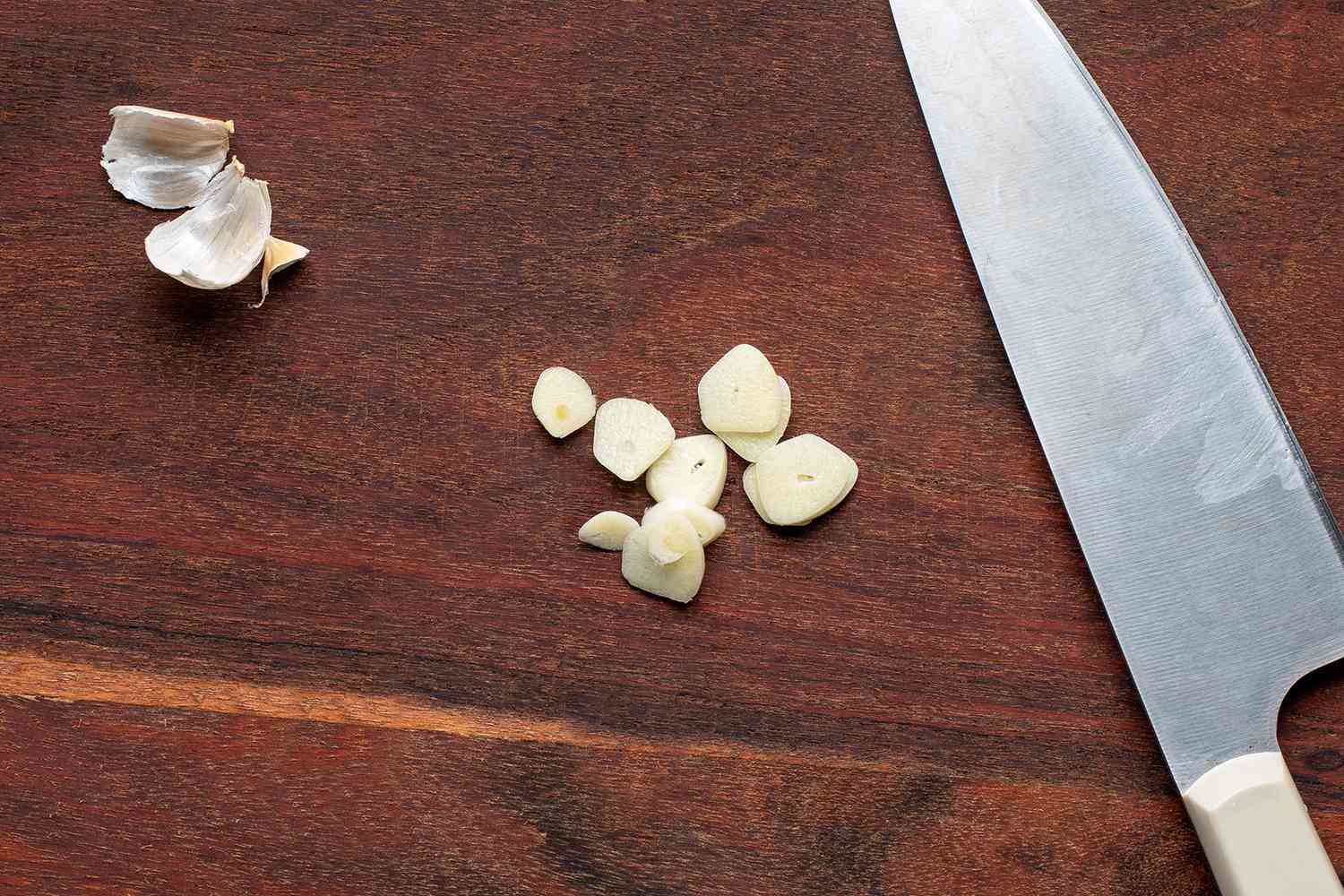 sliced garlic on a cutting board