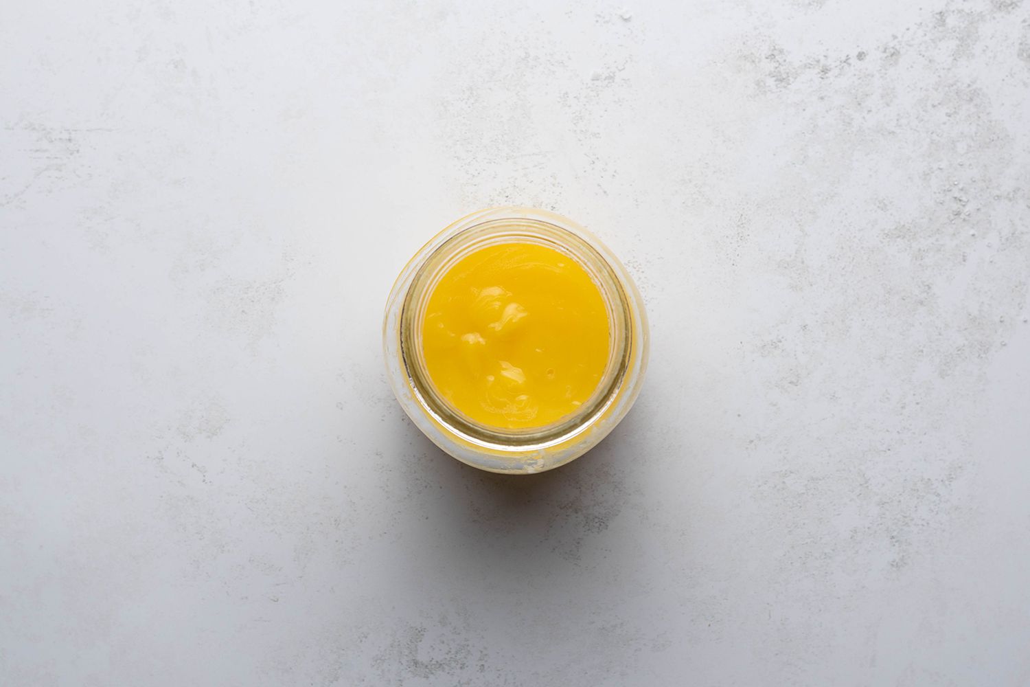 Instant Pot Lemon Curd in a glass container 