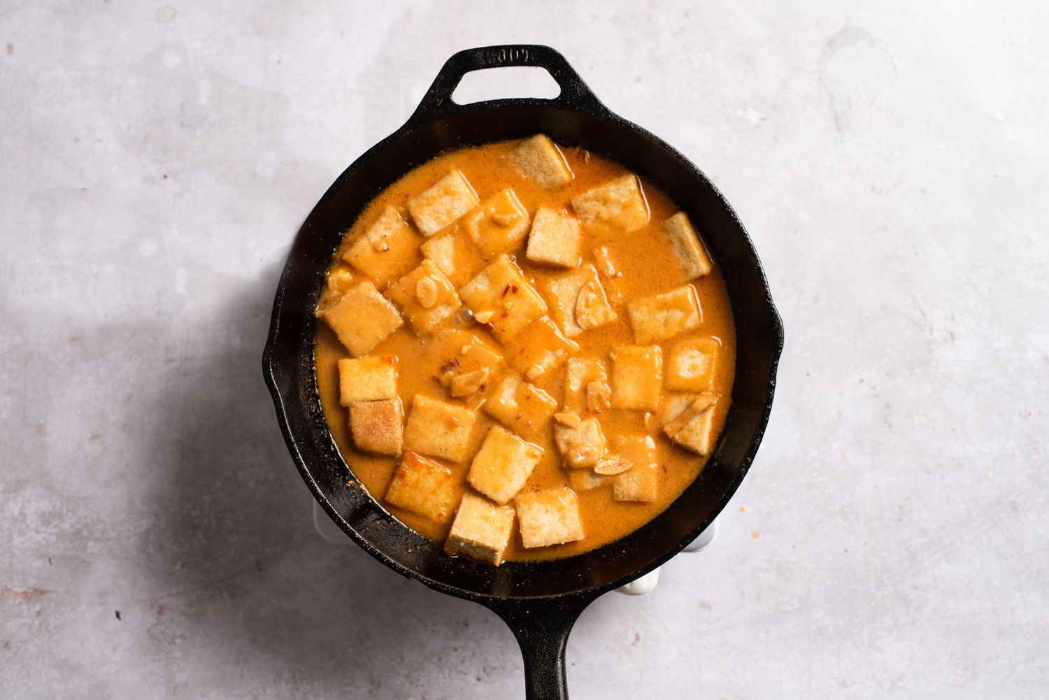 Tofu added to the pan, cooking in the miso-orange sauce