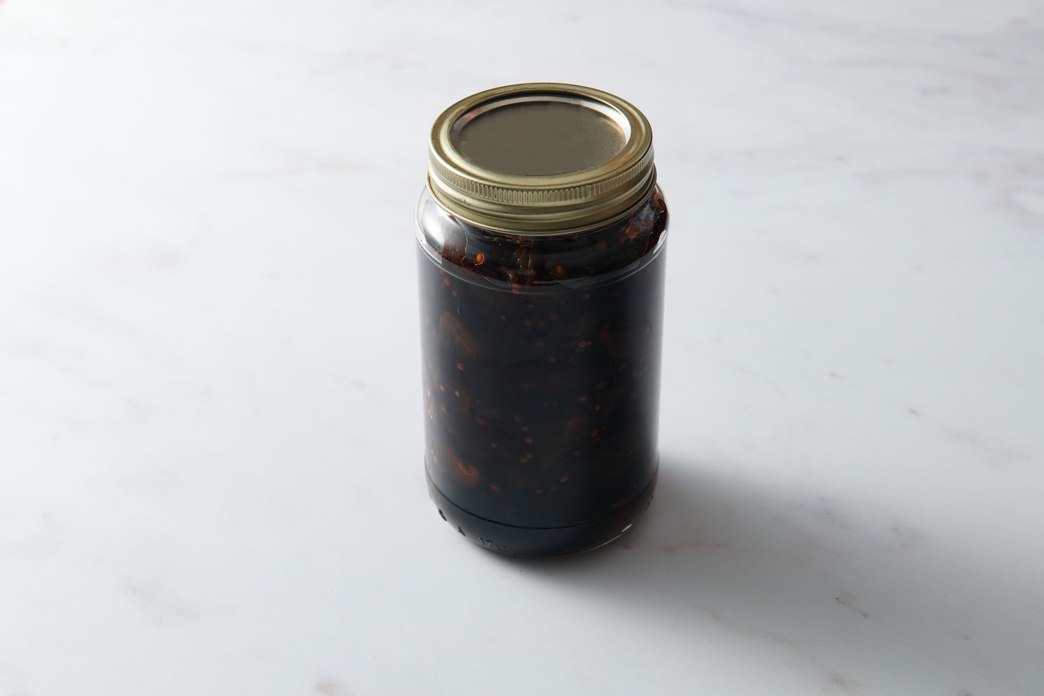 A sealed jar of soy sauce-pickled shiitake mushrooms