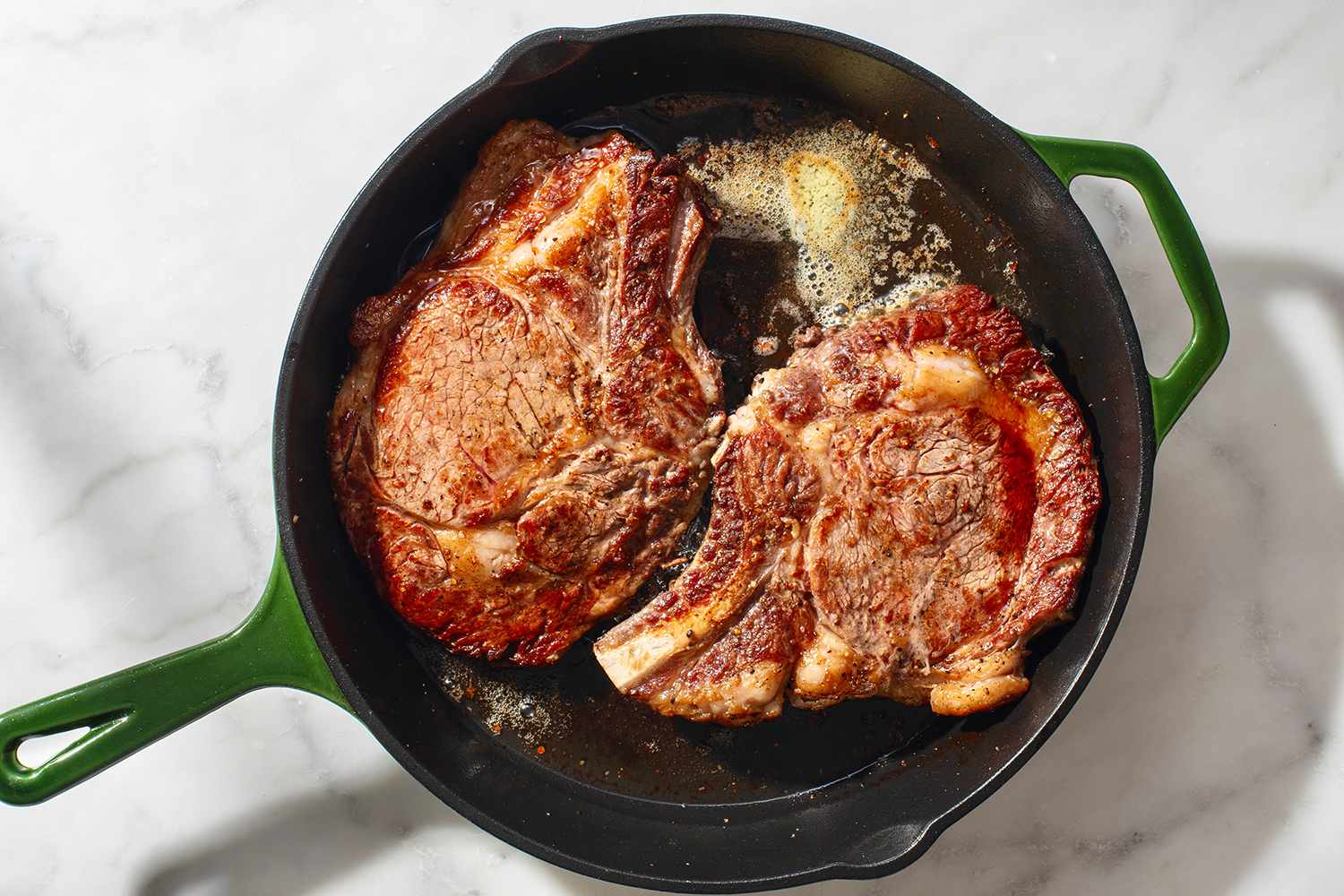 seared steaks in cast iron skillet