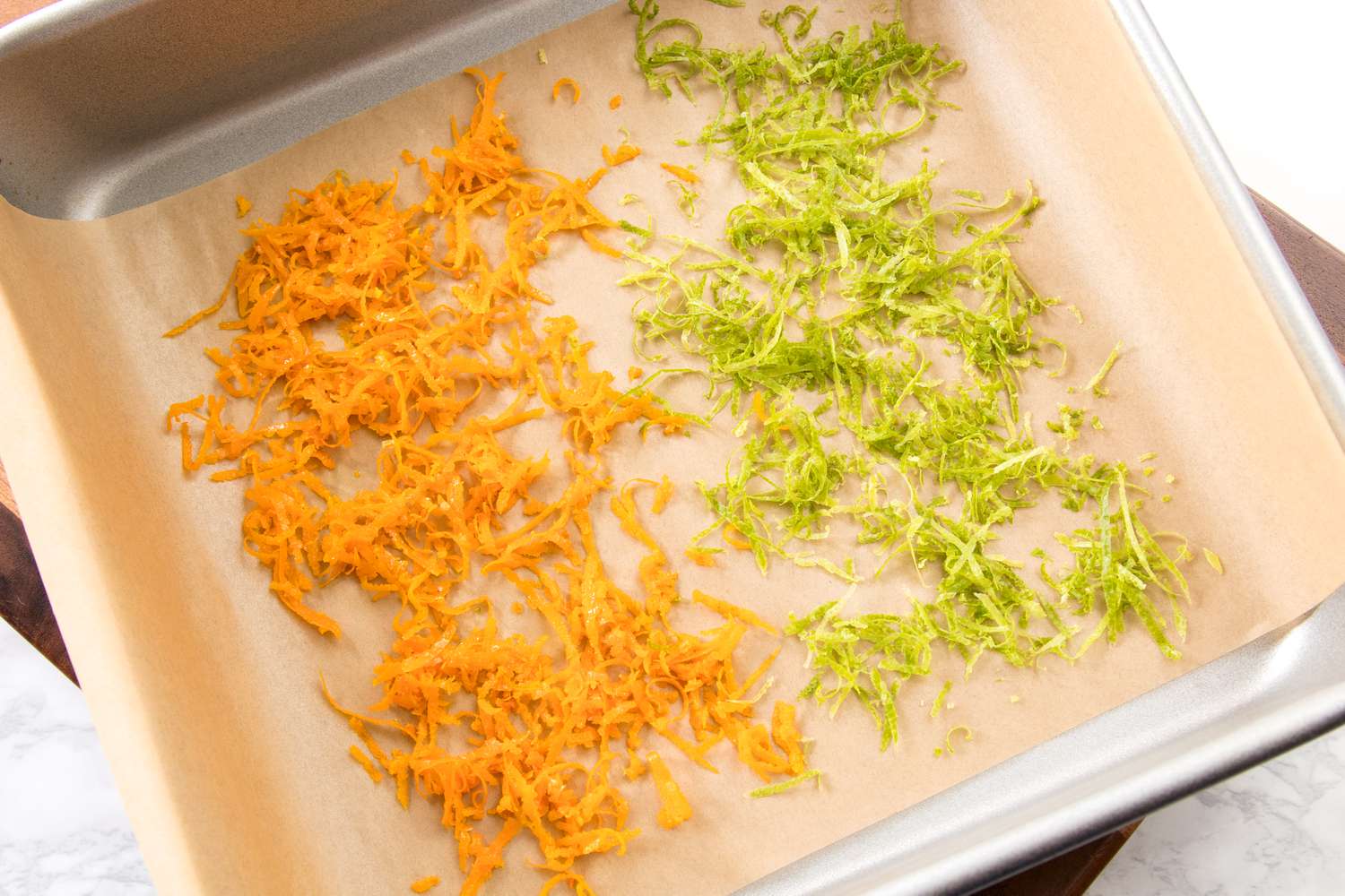 Orange and Lime Zest on a parchment-lined baking sheet