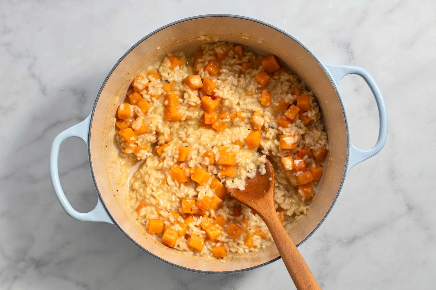 cooked butternut squash risotto in dutch oven removed from heat