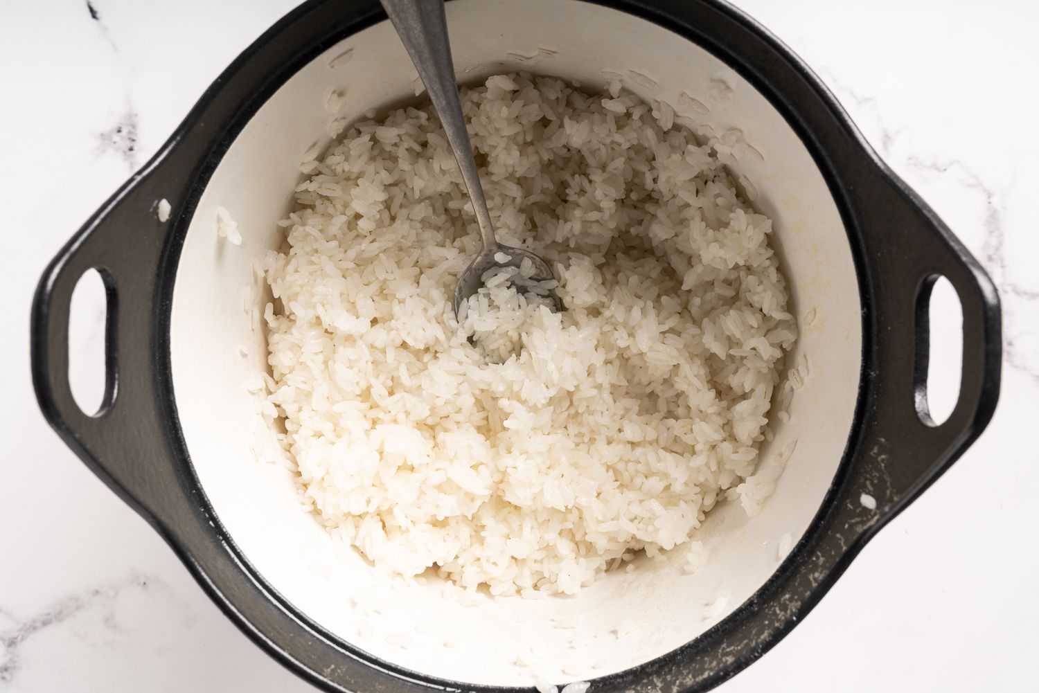 Cooked rice that has been fluffed in a pot