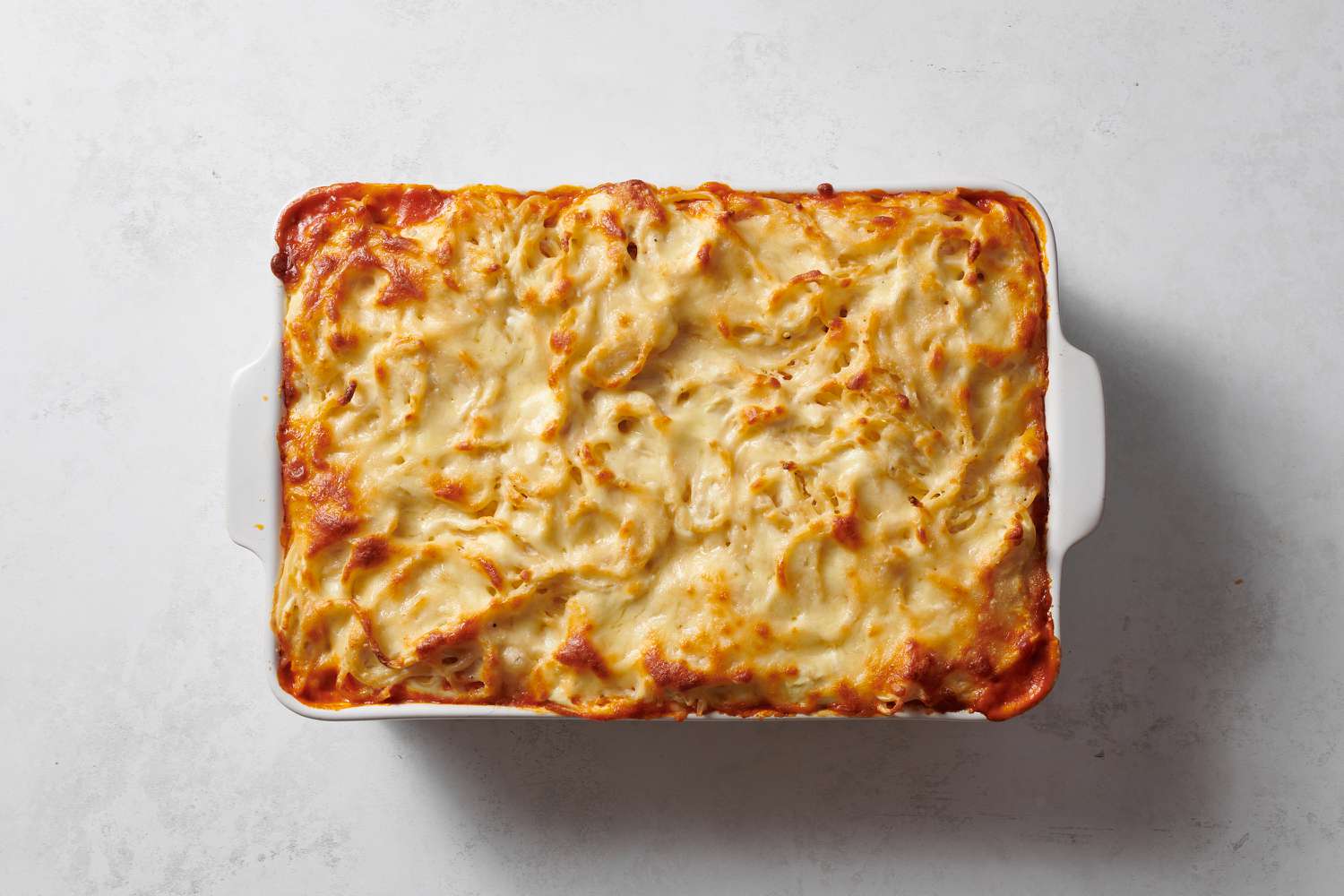 A baked pasta casserole topped with melted cheese