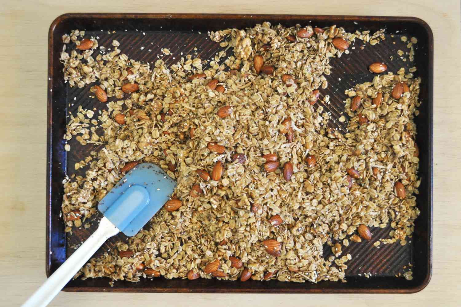 Granola cooking on a sheet pan