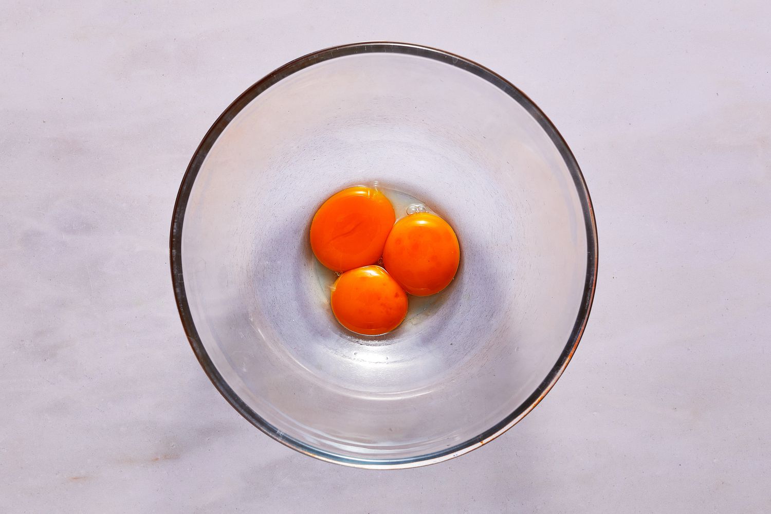 3 egg yolks in bowl