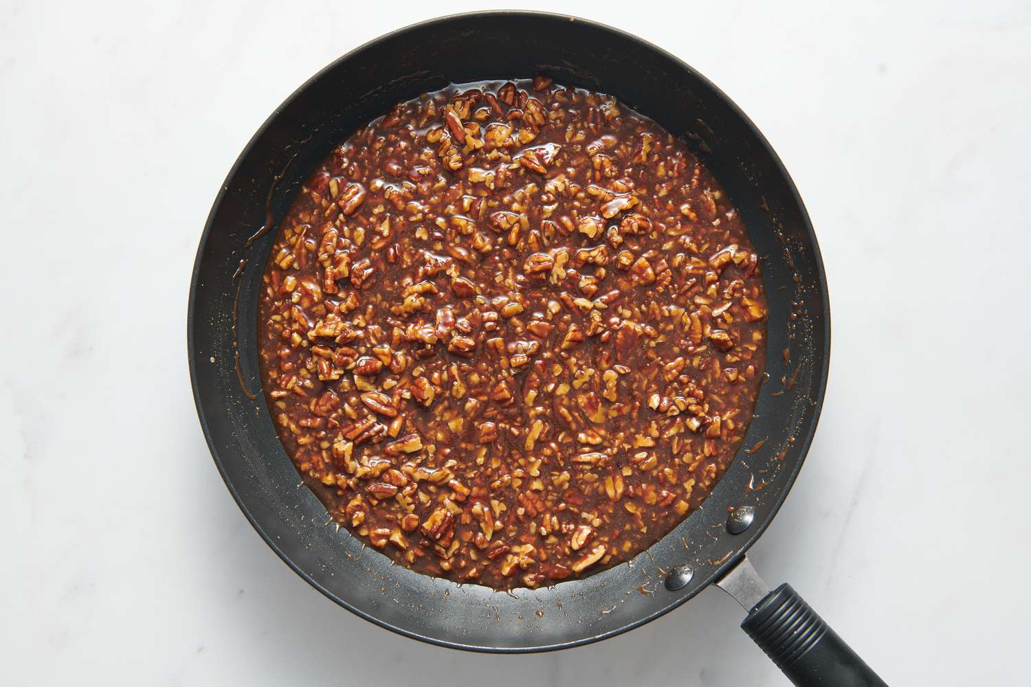 A large pan of pecan pie tamale filling