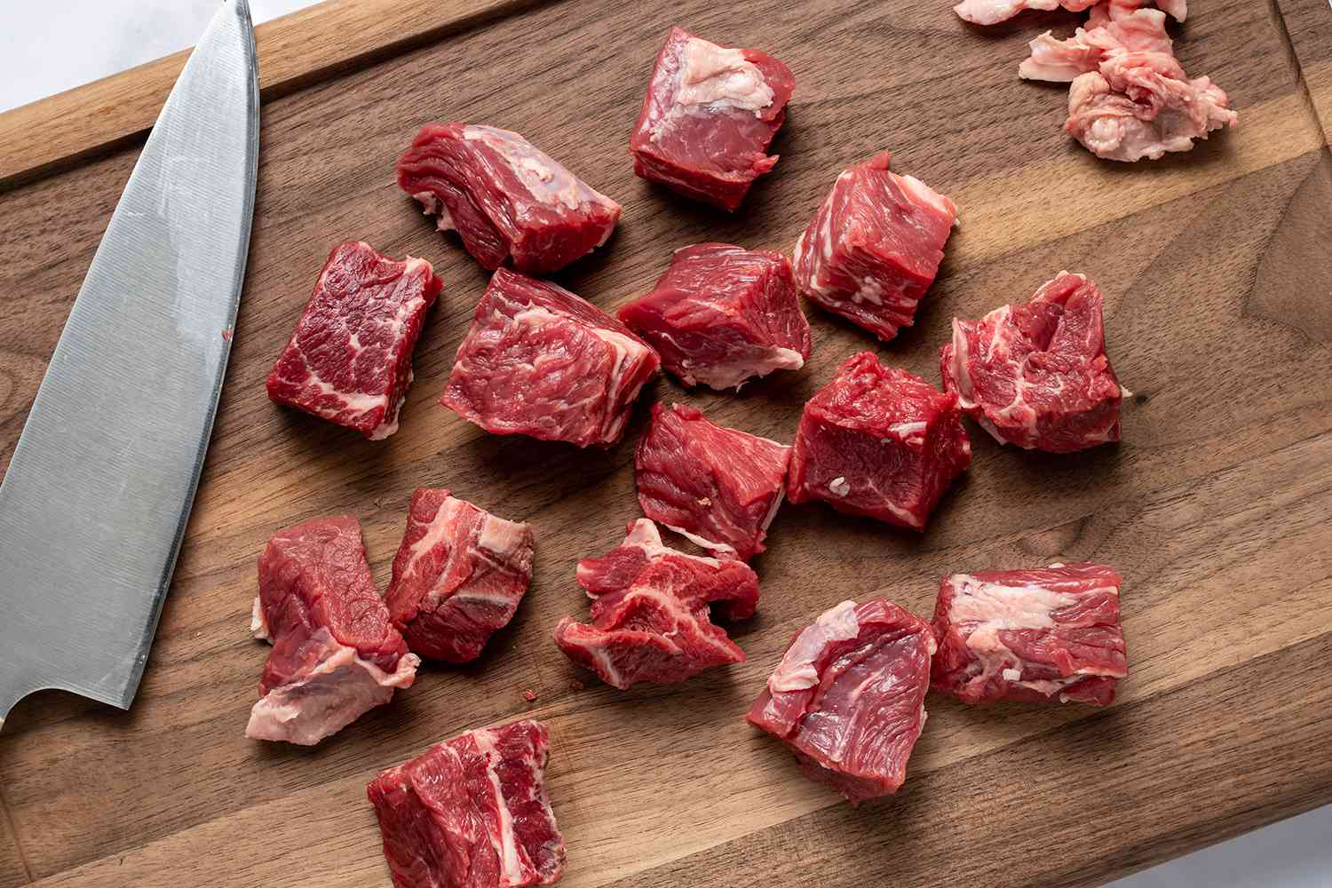 sliced, seasoned meat on a cutting board 