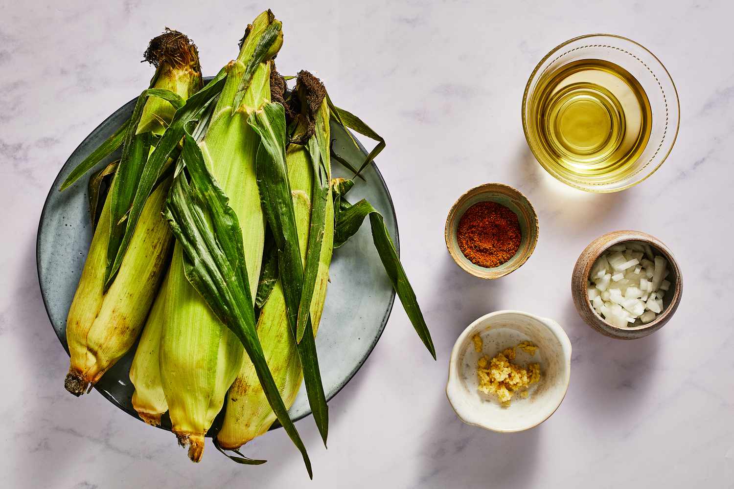 Ingredients to make cajun-style corn on the cob
