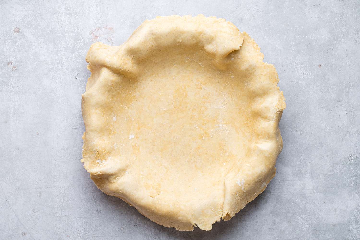 pie crust draped on pie pan