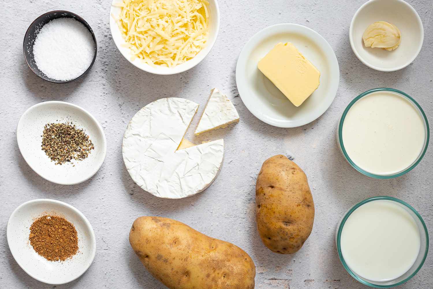 Ingredients for making potato gratin gathered