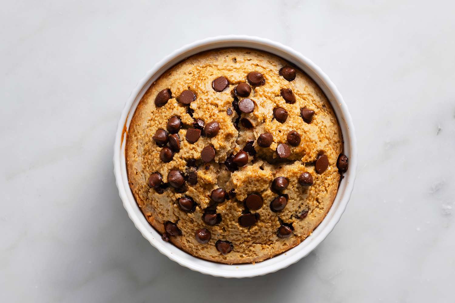 Blended Baked Oats with chocolate chips in a ramekin 