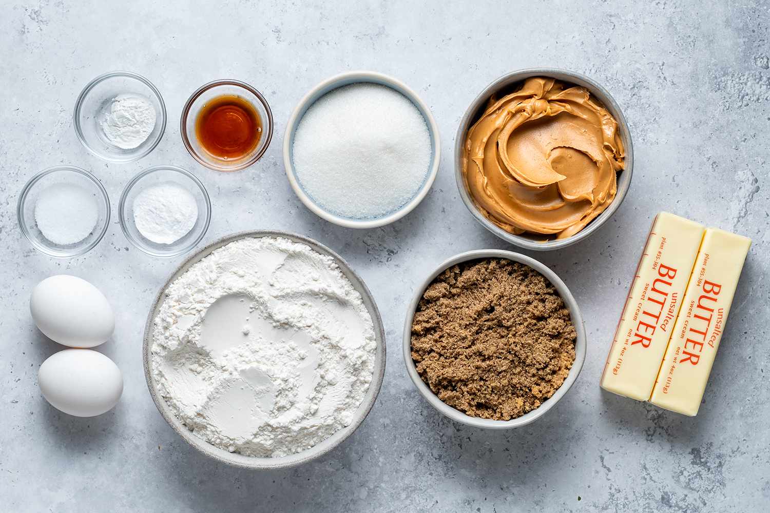 Soft and Chewy Peanut Butter Cookie ingredients in bowls 