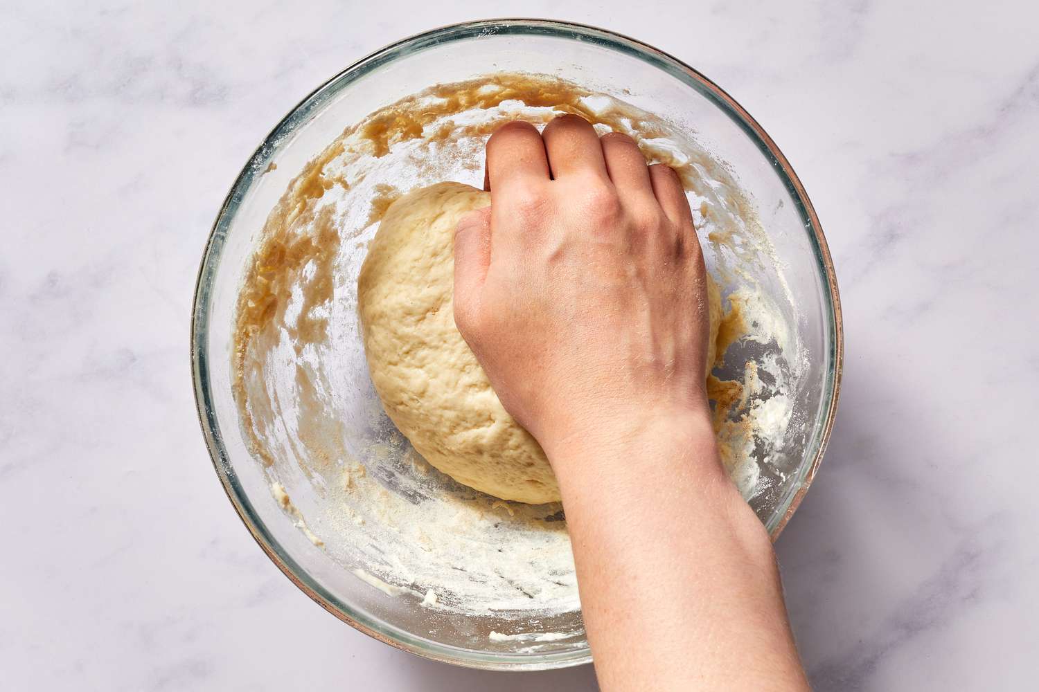 Knead dough in a bowl 