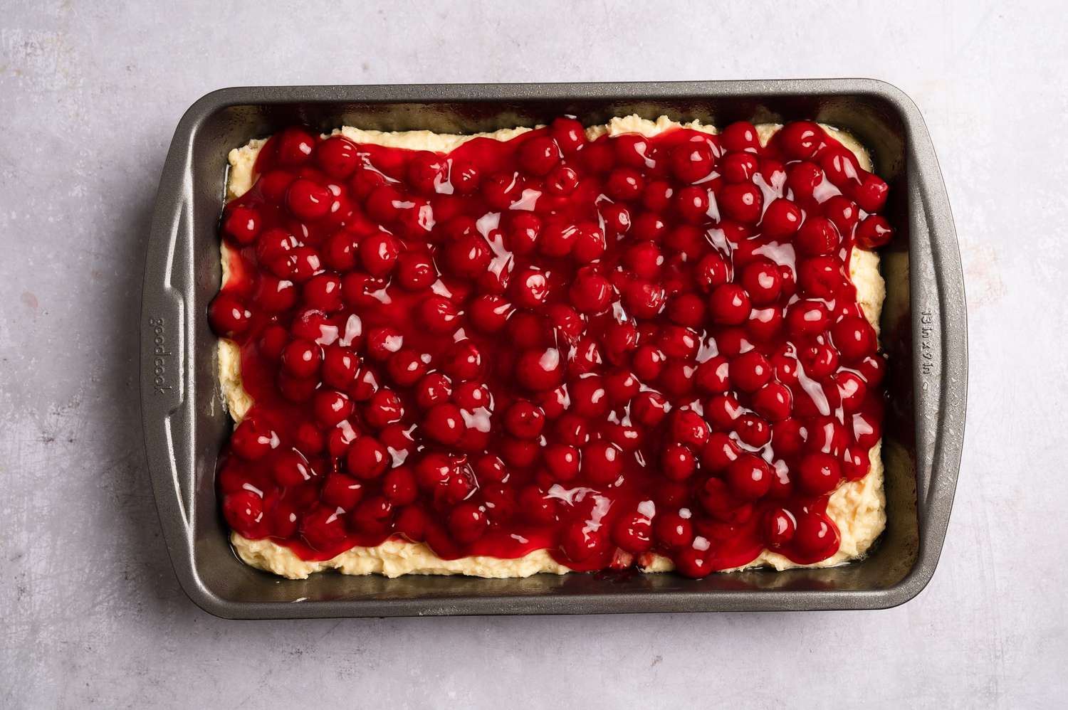 Cherry pie filling on top of the cake batter