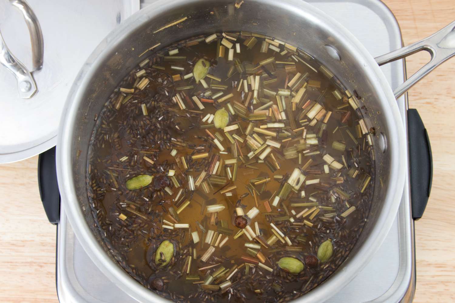 Simmering Botanicals for Homemade Cinchona-Free Tonic Syrup