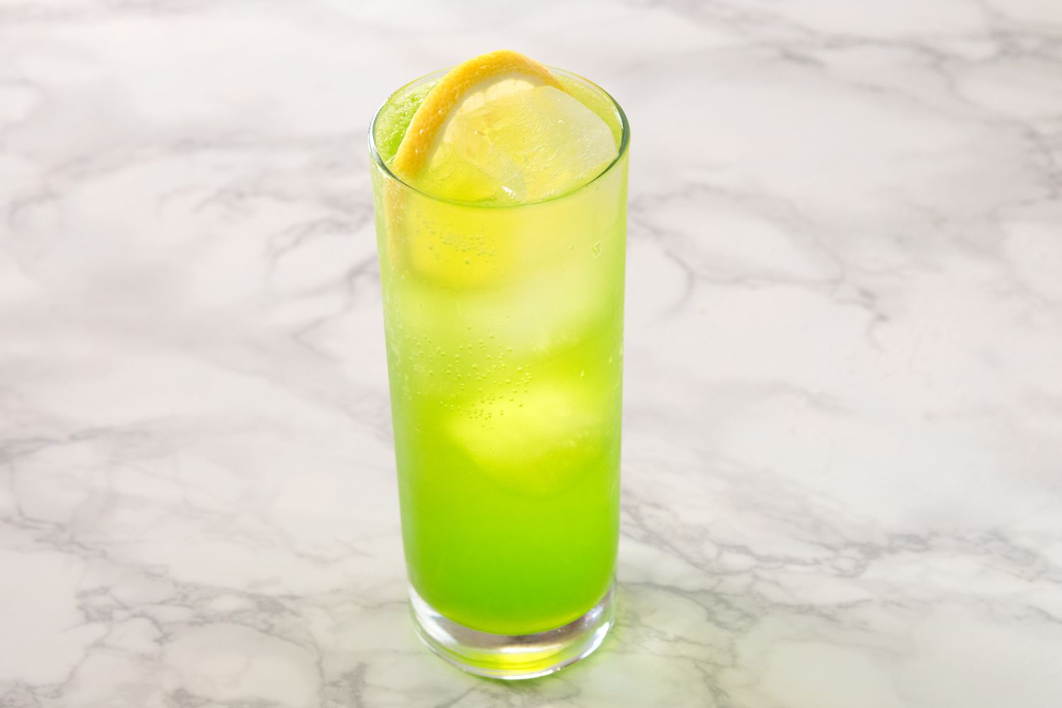 Midori Sour Cocktail With Lemon Wheel