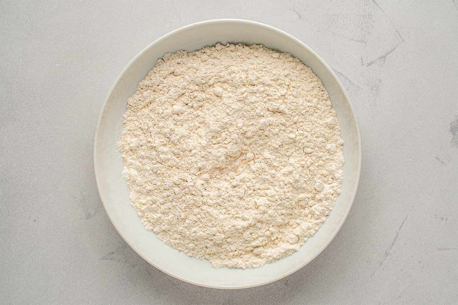 Flour, cornstarch, sugar, garlic powder, onion powder, paprika, chili powder in a bowl