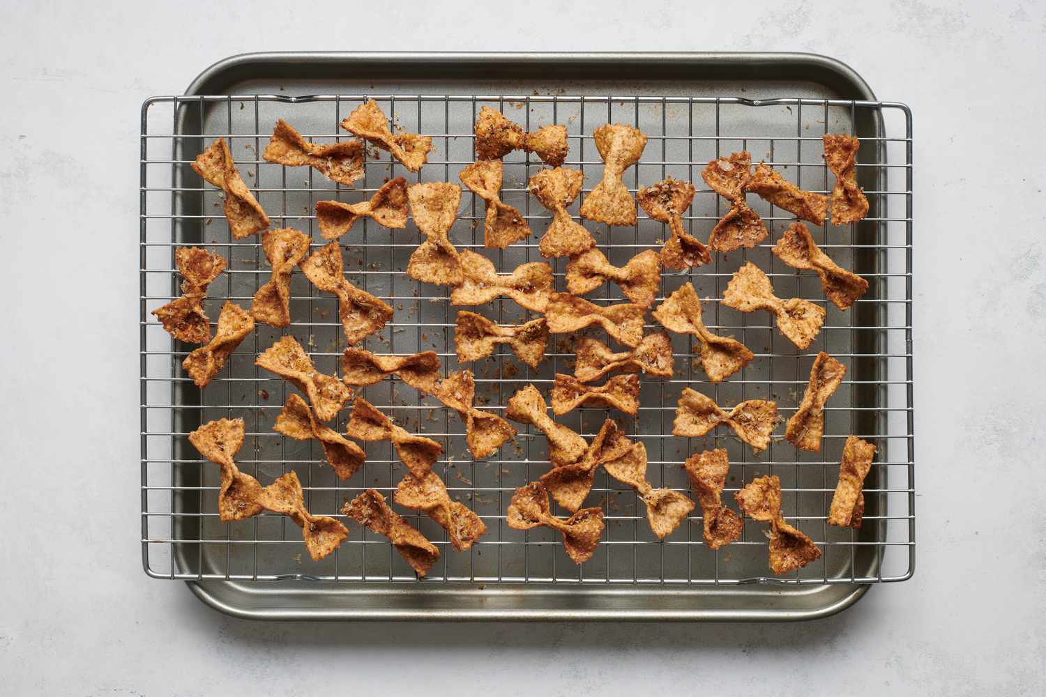 Seasoned pasta chips on a cooling rack