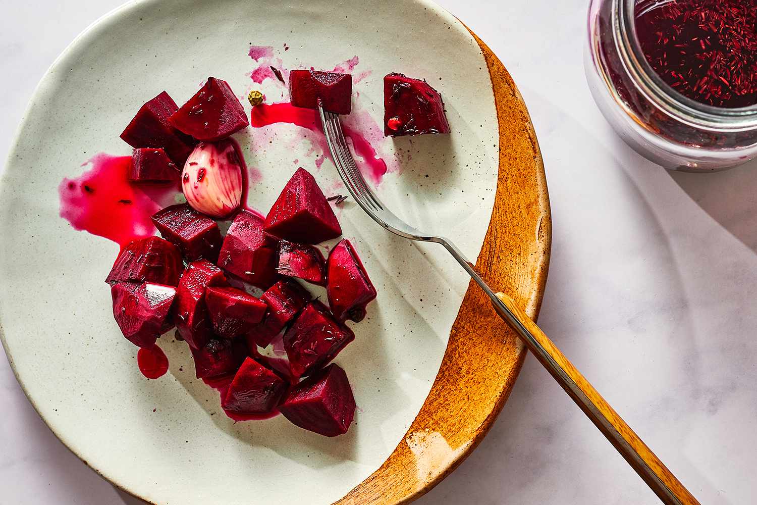 Fermented Beets on a plate with a fork 