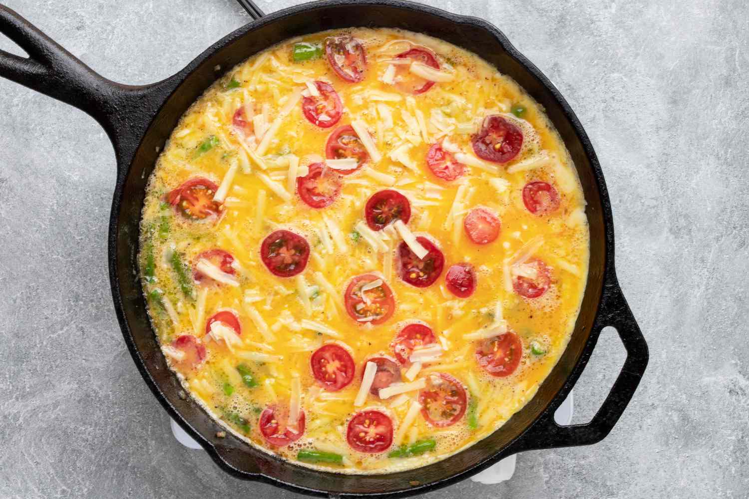 Cooking a frittata in a cast iron skillet.