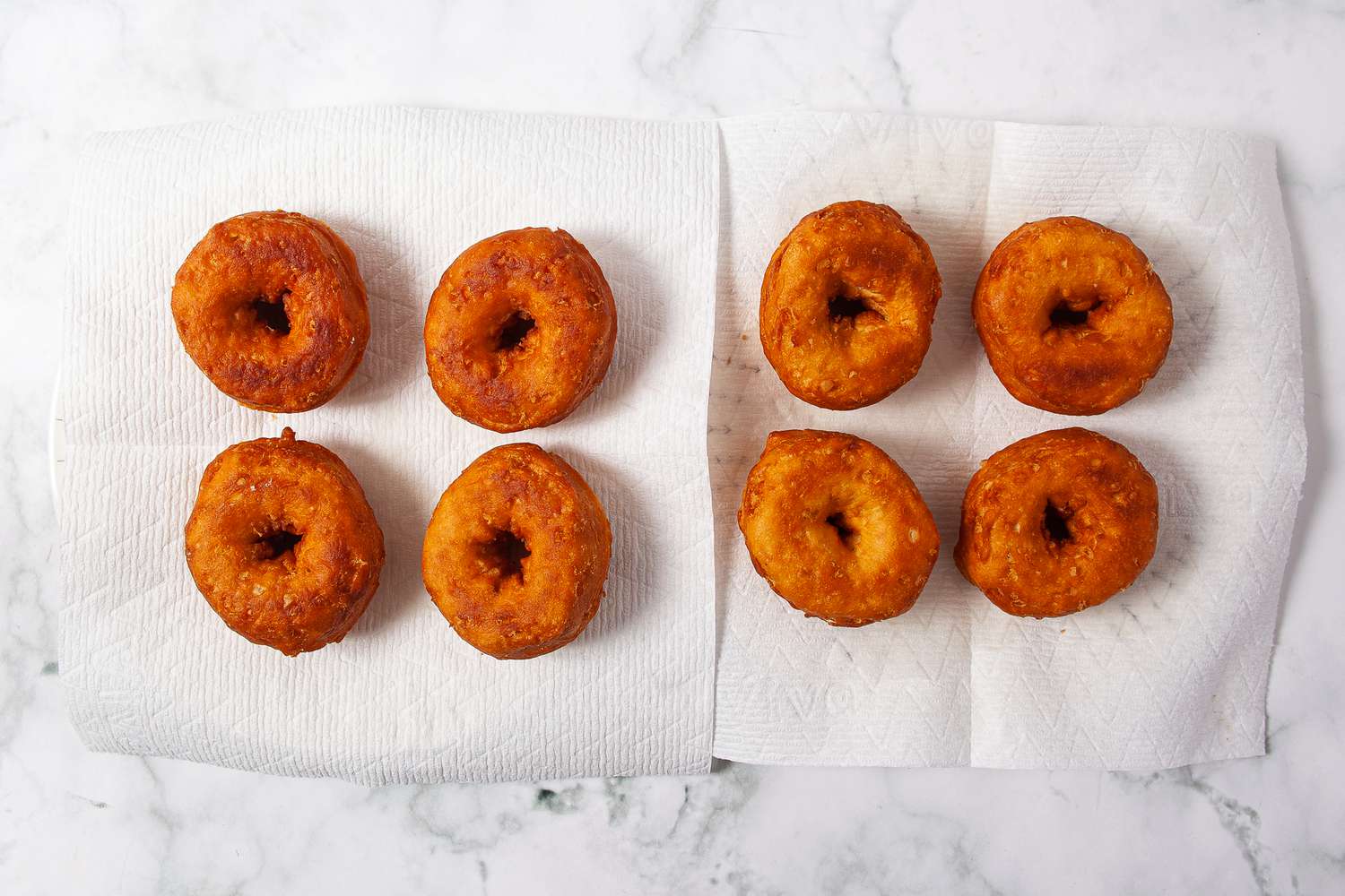 Fried doughnuts on paper towels