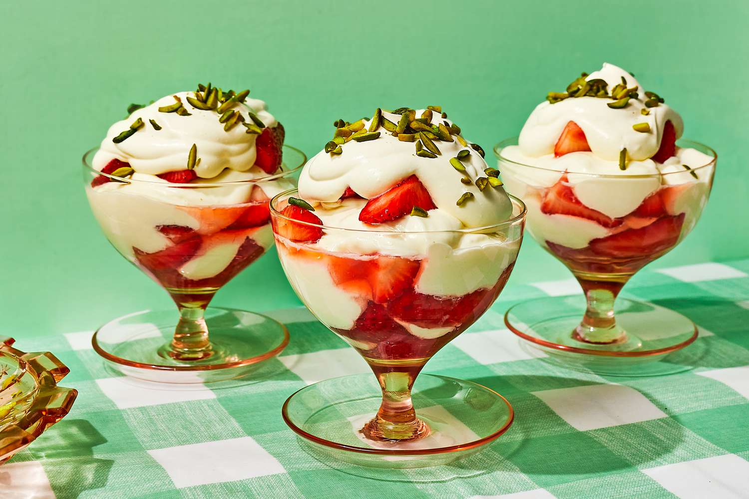 Fresas con crema topped with whipped cream and nuts