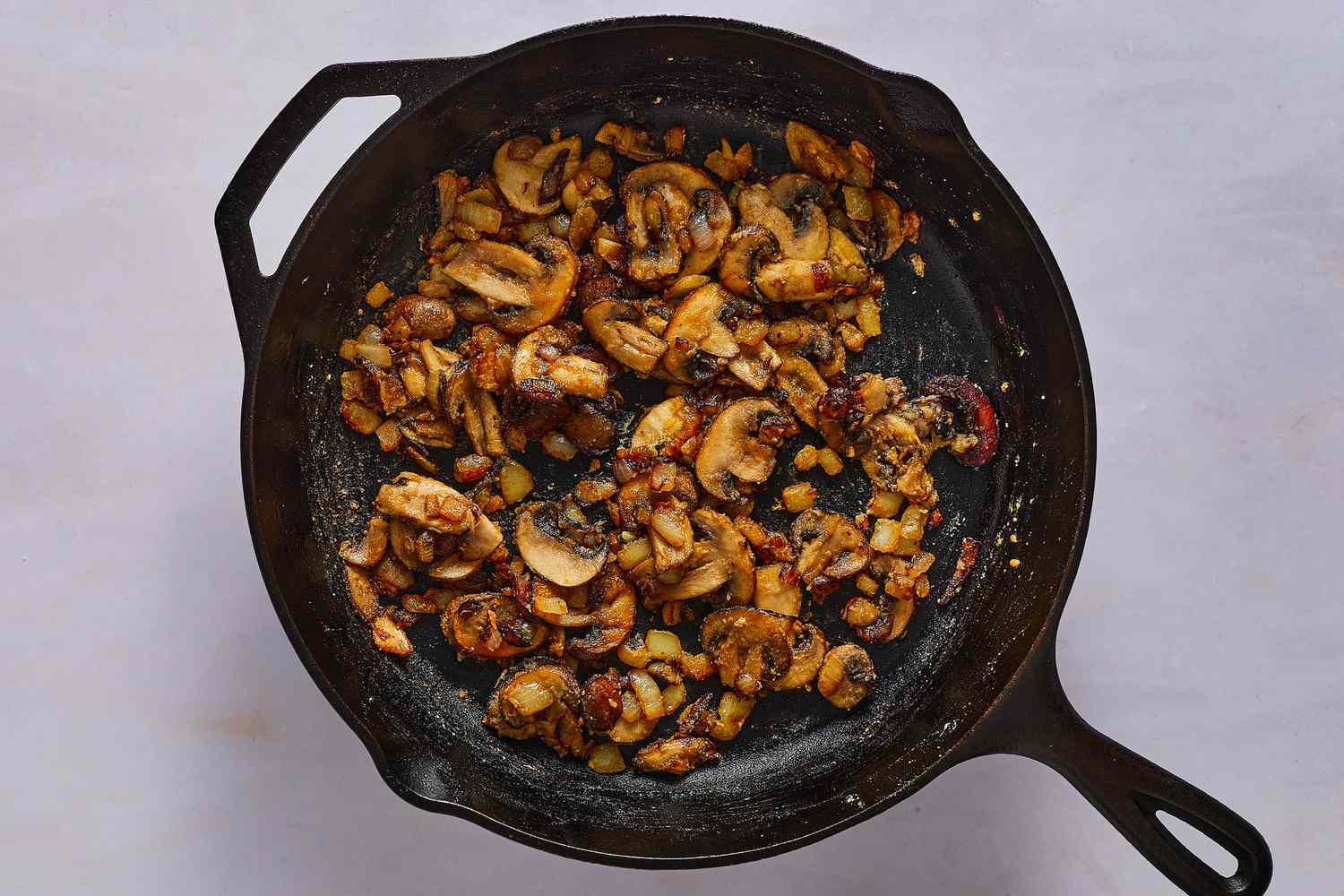 Flour added to the skillet of mushrooms