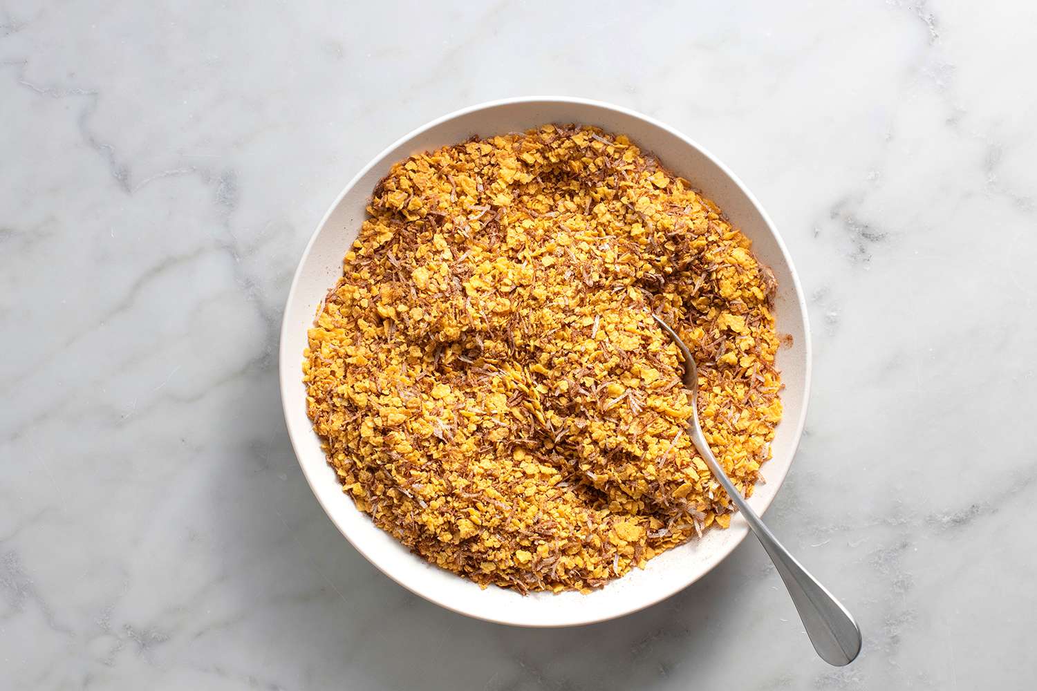 A bowl with cornflakes, coconut, and cinnamon