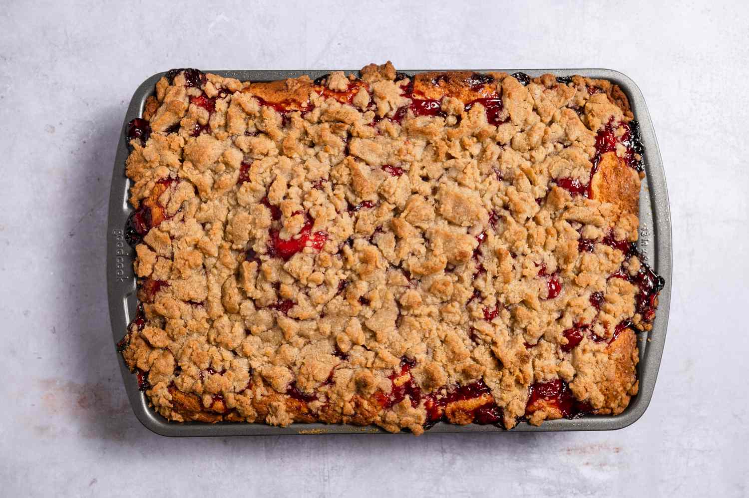 A cooked cherry crumb cake
