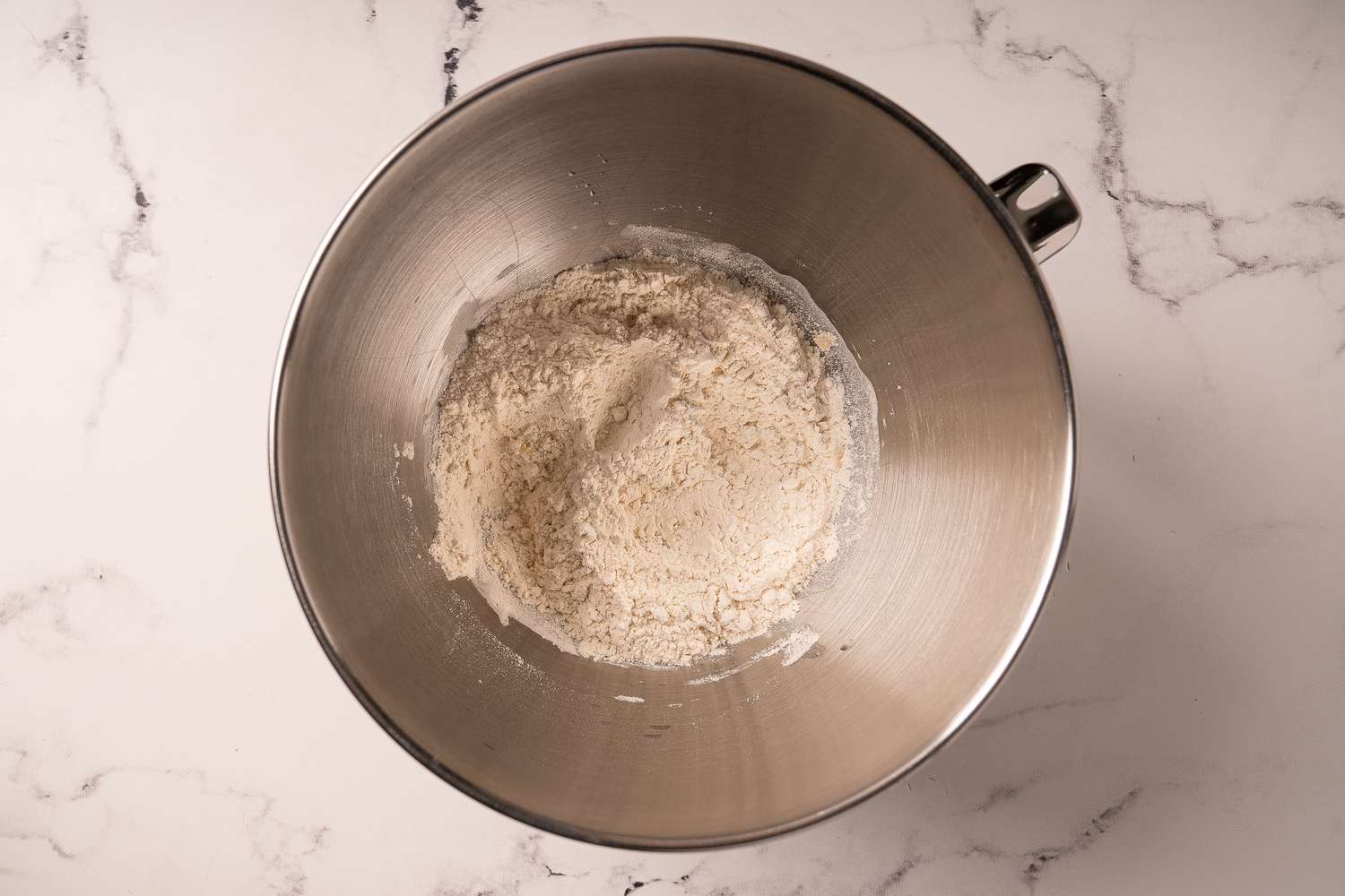 Flour added to the mixing bowl