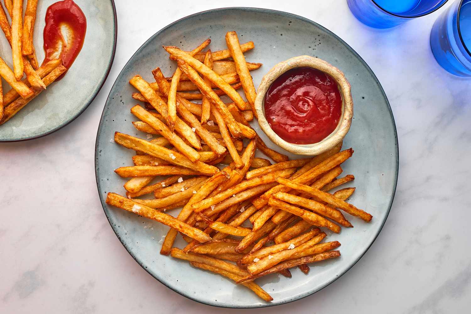 Homemade French Fries on a plate with ketchup 