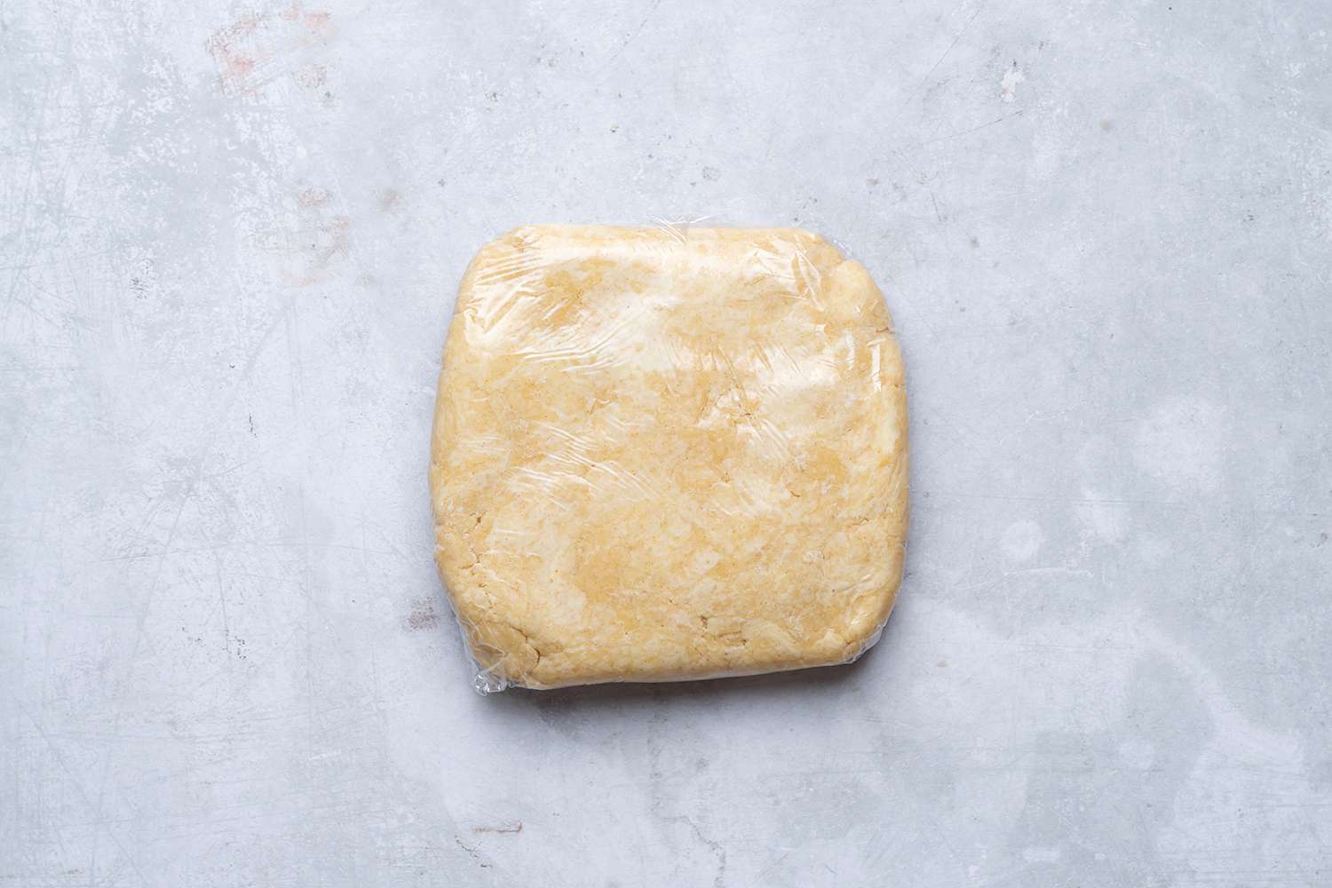 pie crust dough wrapped in plastic