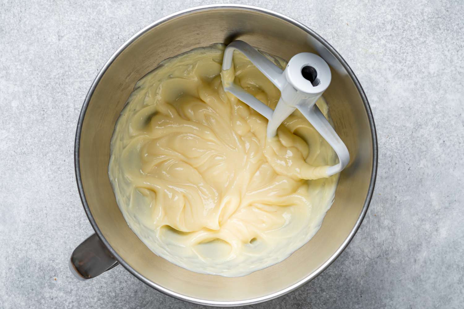 Chilled pastry cream in the bowl of a stand mixer