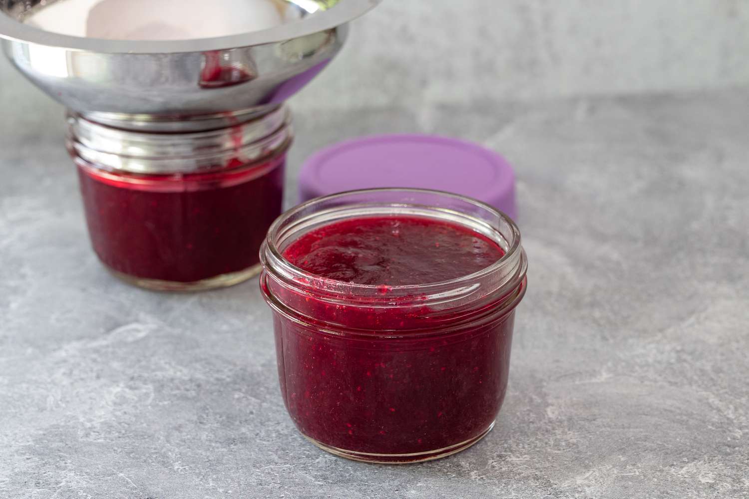pour the homemade cranberry sauce into jars