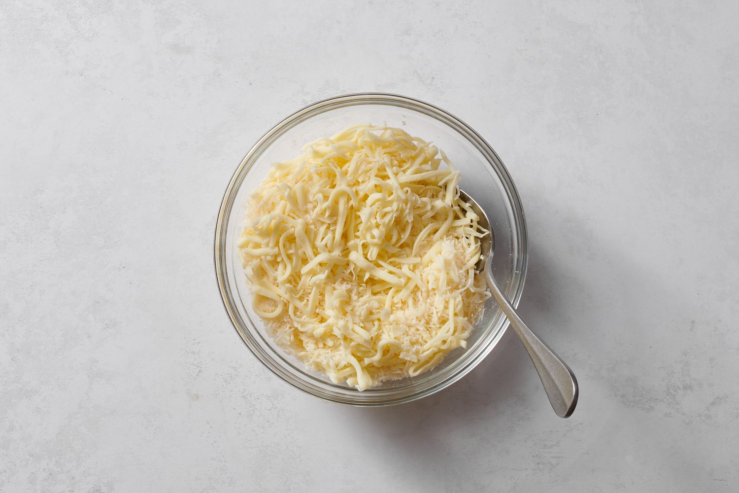 Shredded mozzarella and parmesan cheese in a bowl