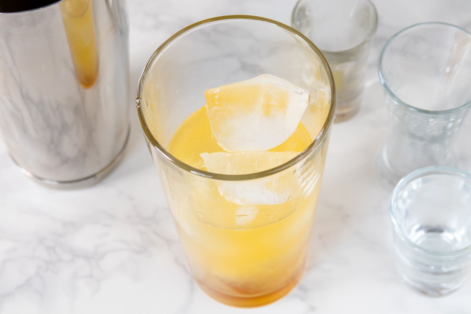Mixing a Tequila Kombucha Mule Cocktail With Mango Nectar
