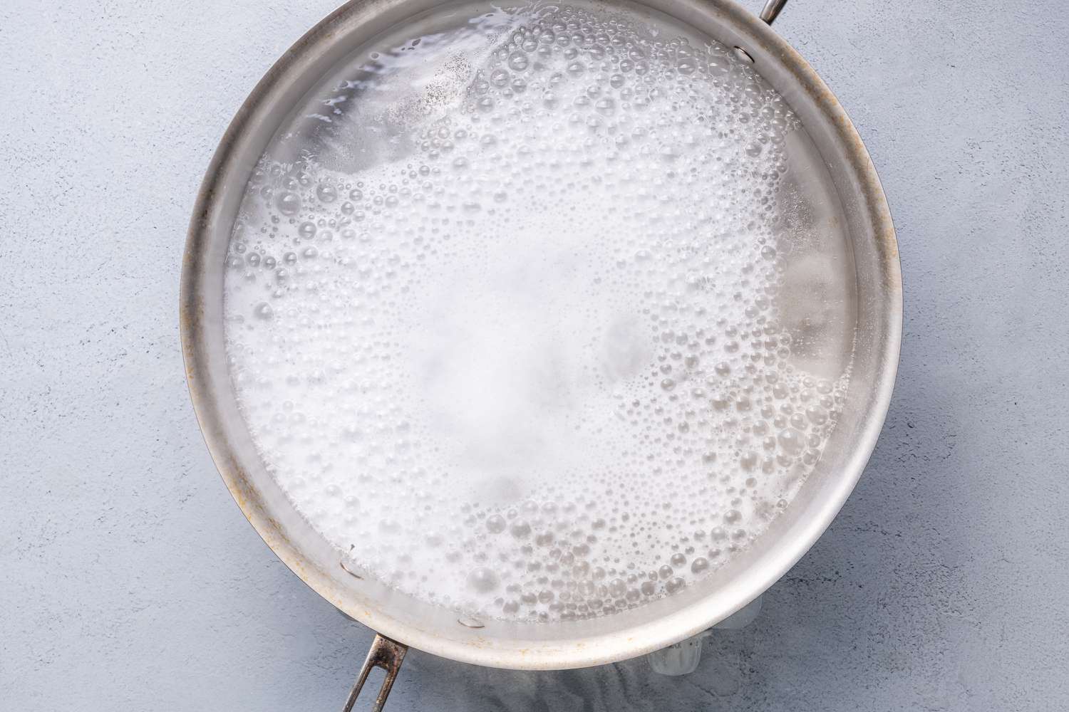 Baking soda added to the pot of boiling water