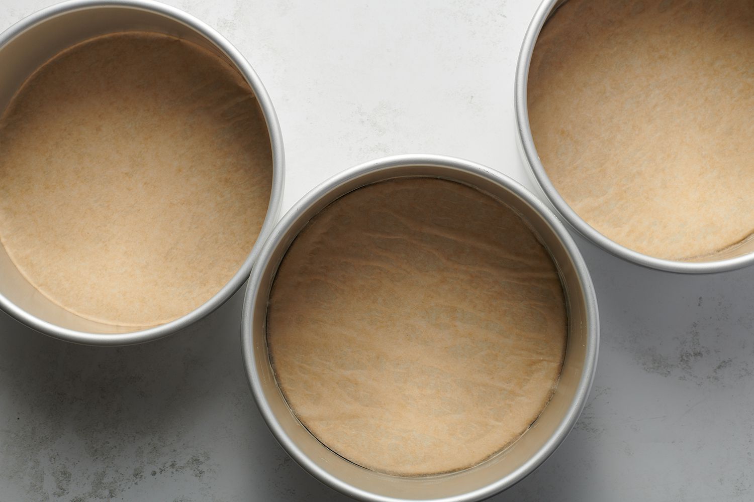 round cake pans lined with parchment paper
