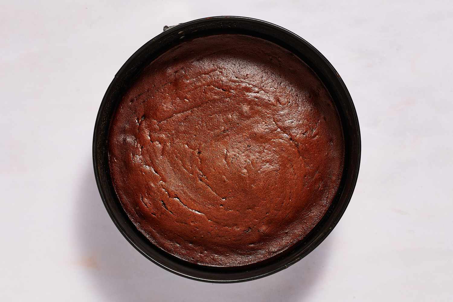 cooked chocolate cake in springform pan