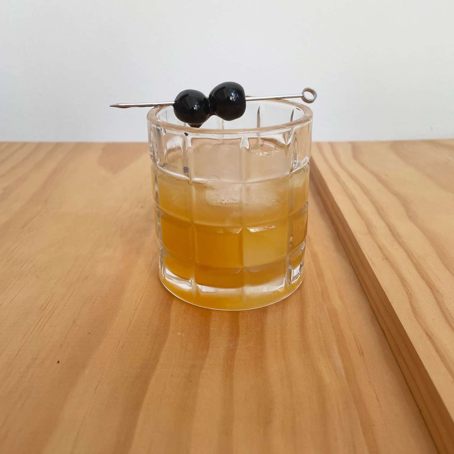 Amaretto sour cocktail tarnished with cherries
