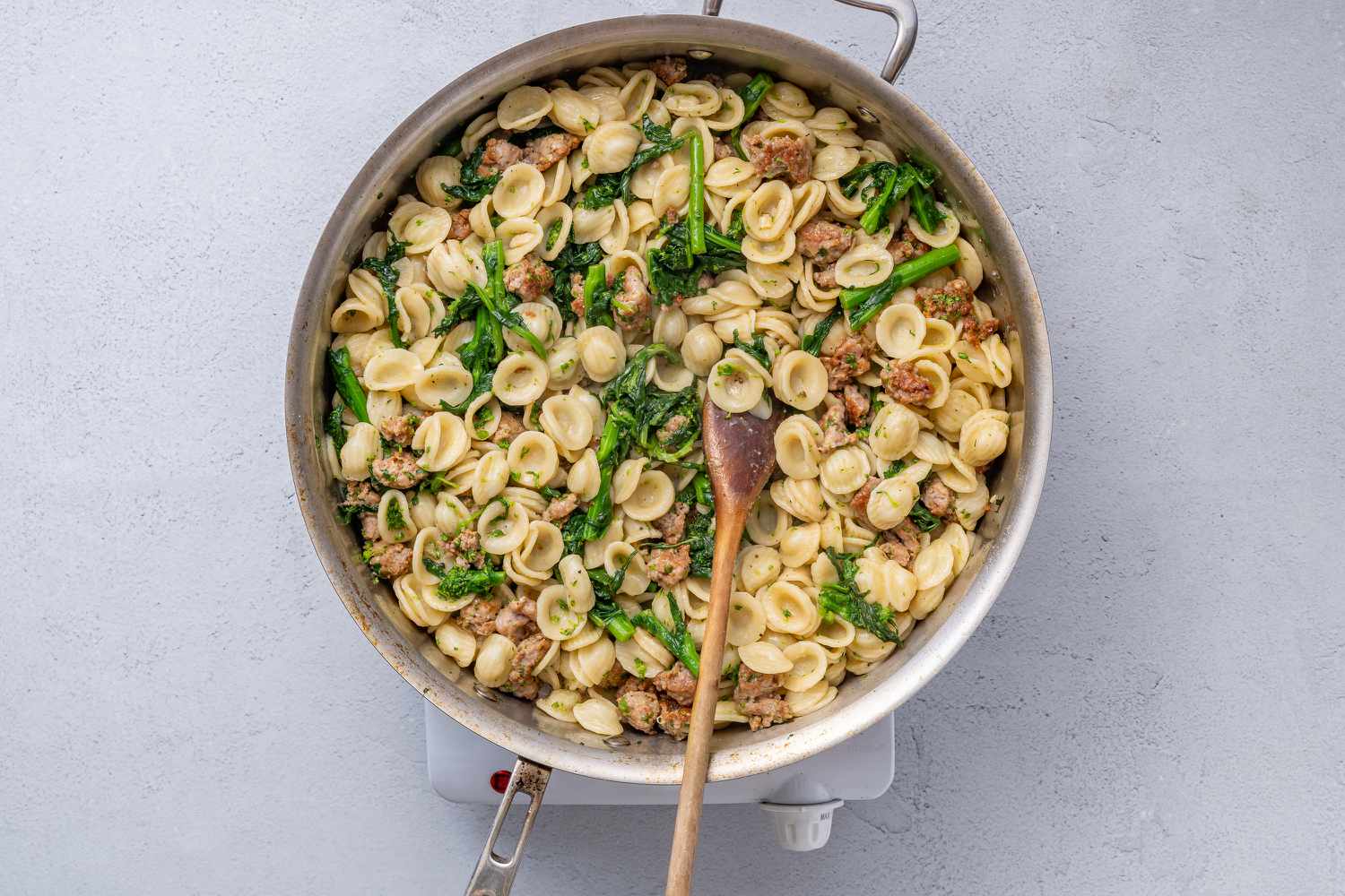 A pot of orecchiette with sausage and broccoli rabe