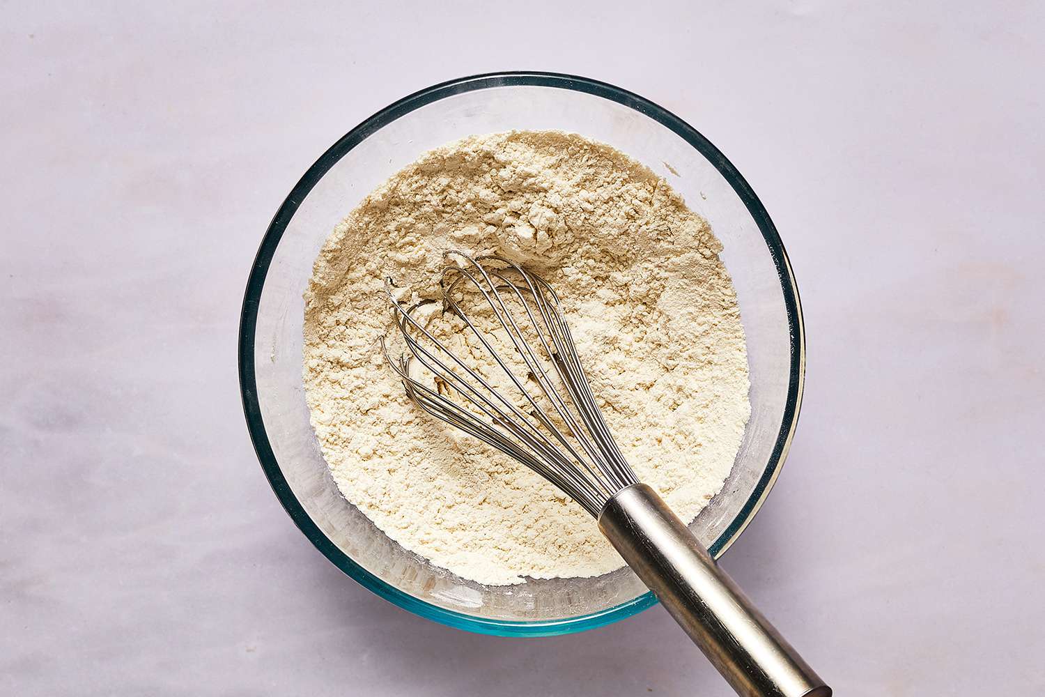 pancake dry ingredients in a bowl with a whisk 