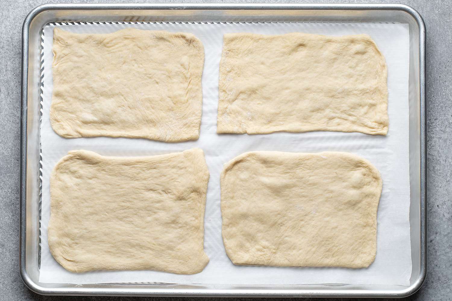 rectangular pieces of down on lined baking sheet