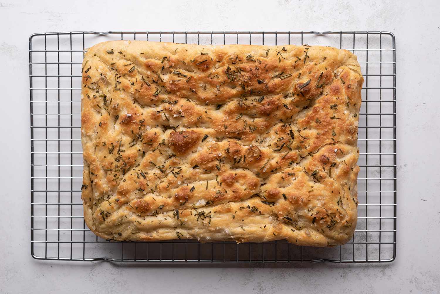 Focaccia Bread on a cooling rack 