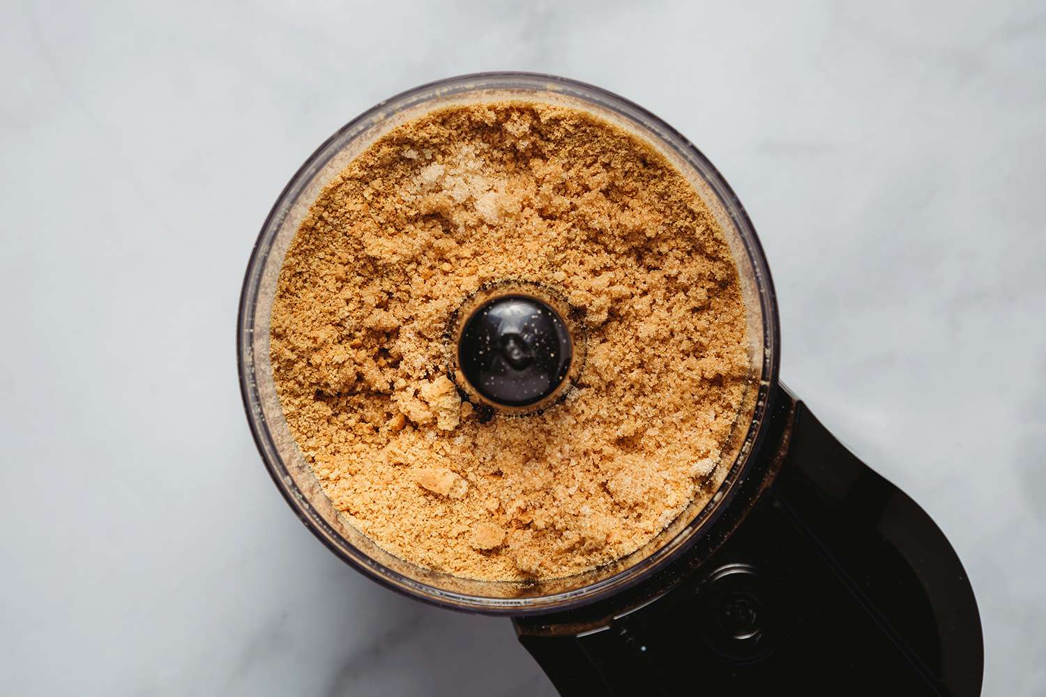 Graham cracker mixture and brown sugar in a food processor 