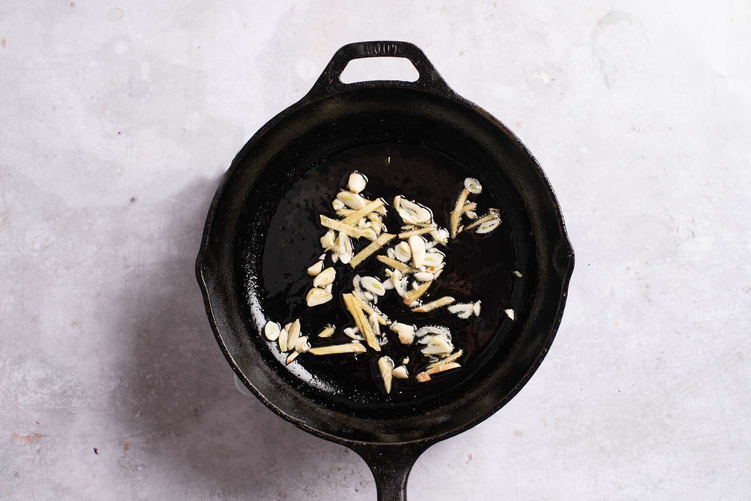 Ginger and garlic cooking in a pan