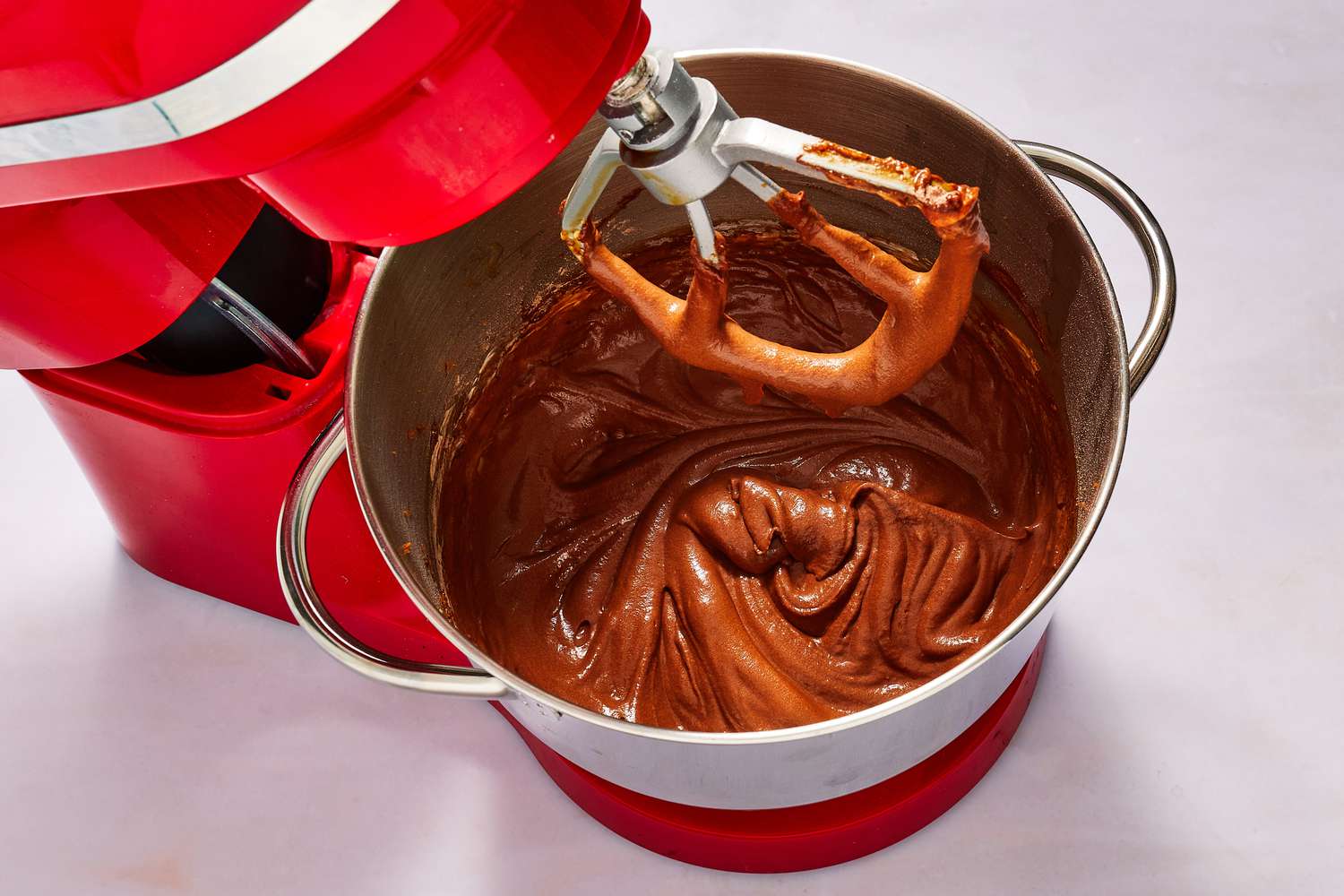cake batter mixed with coffee in bowl of stand mixer