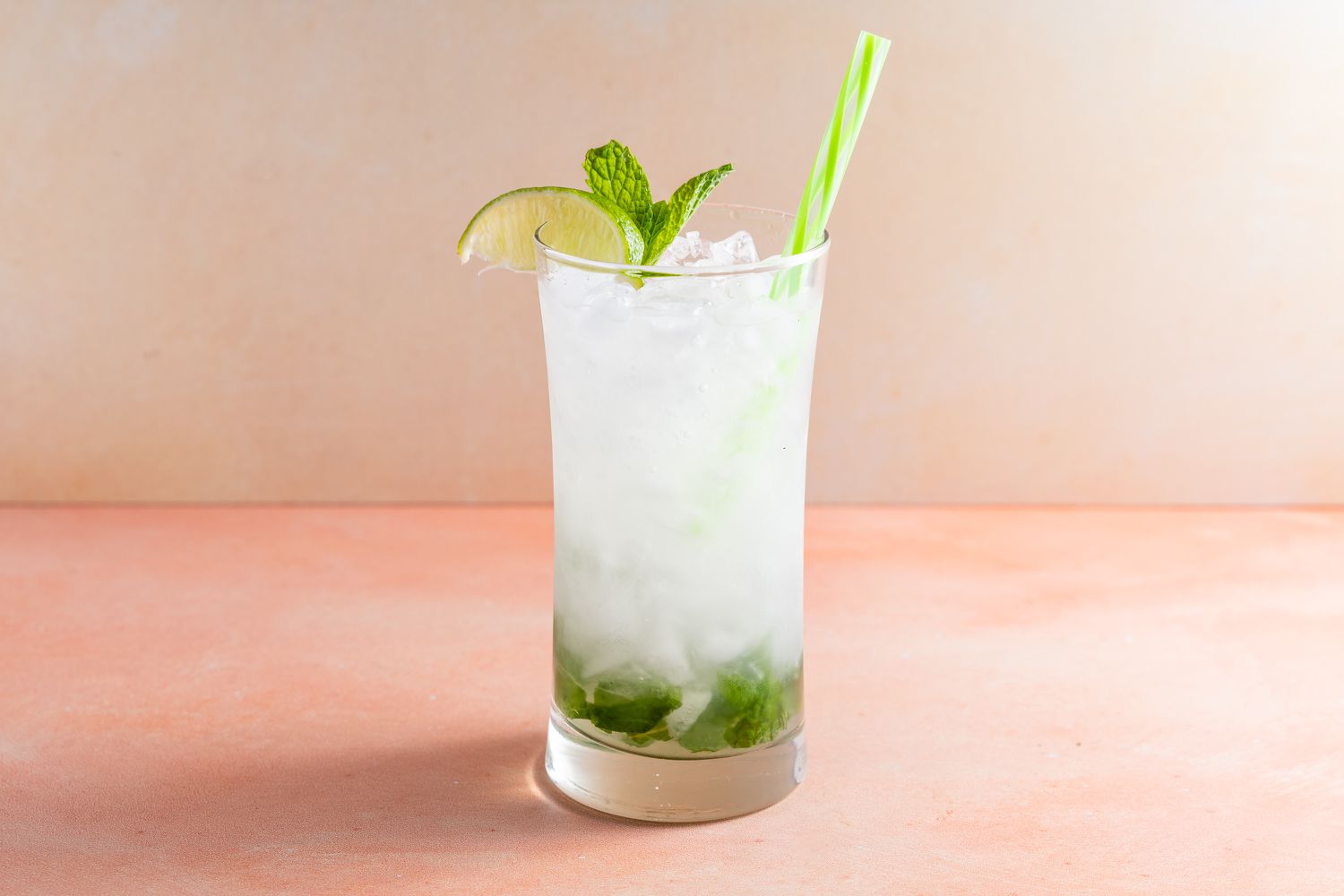 Vodka mojito garnished with mint leaves and lime